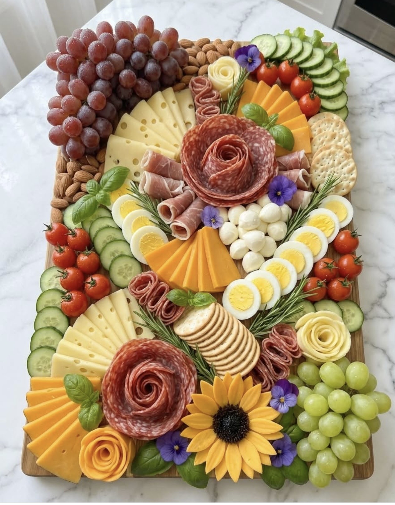Hunt & Honey artisan board with salami roses, swiss cheese, grapes, tomatoes and sunflower